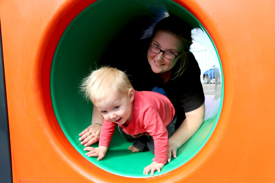 Parent and child playing in playground