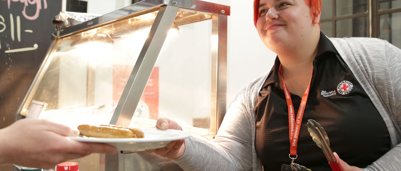 Mikaela serves a meal at the Brisbane Night Cafe