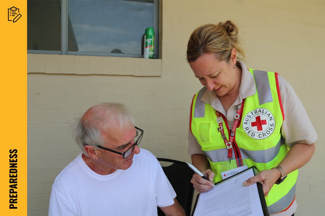 Volunteering filling in paperwork for person