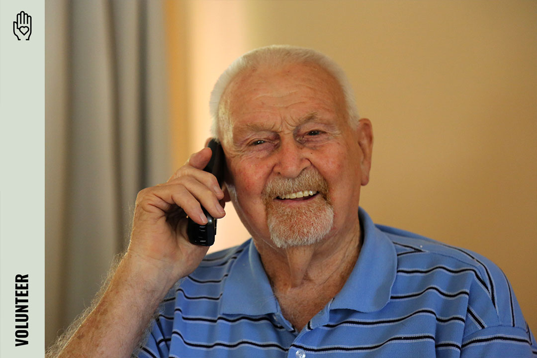 Man smiling on the phone