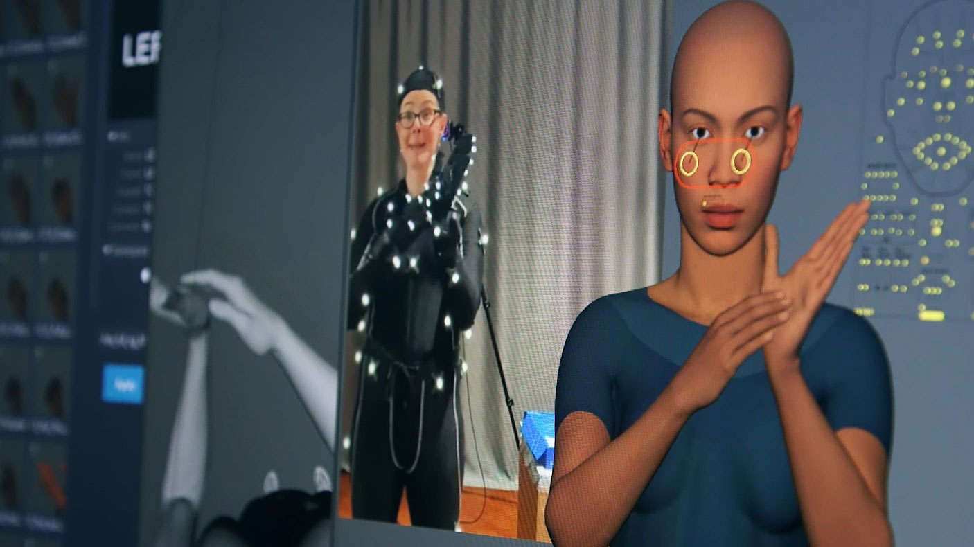 Person demonstrating digital humans on screen